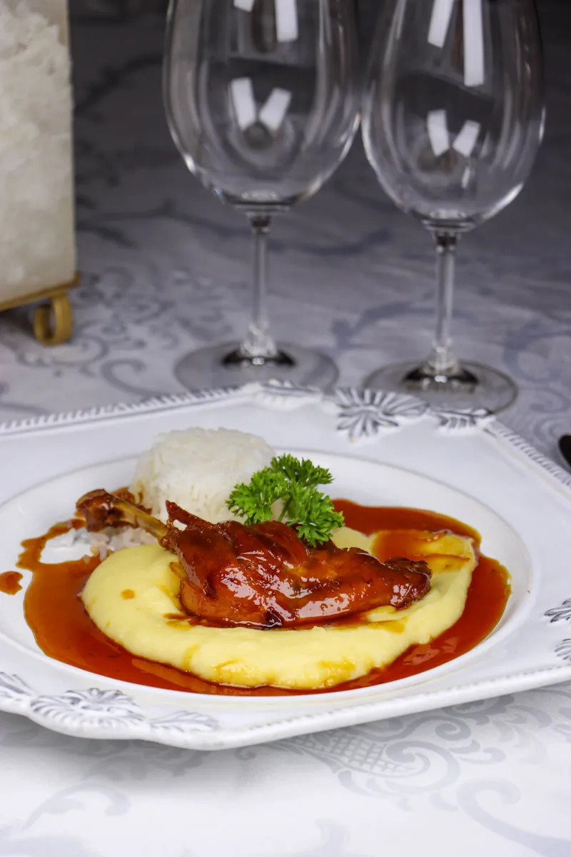 Duck confit with orange sauce and aligot